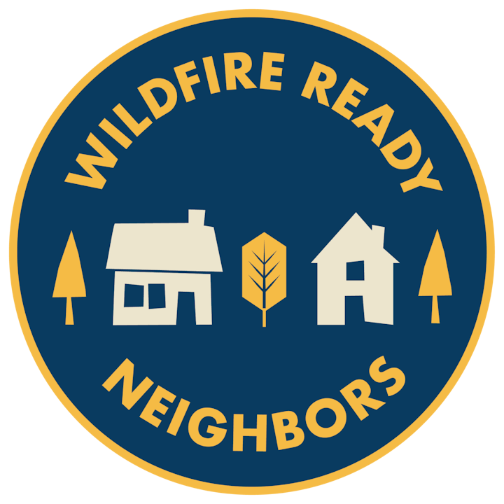 Logo with text "Wildfire Ready Neighbors" and graphics of two houses, two trees, and a leaf.