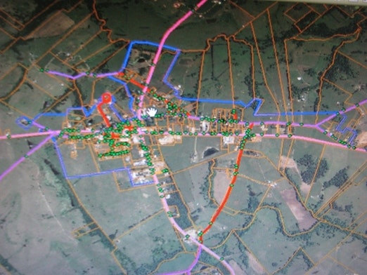 Screenshot of a map with overlaid colorful lines and various symbols, possibly representing infrastructure or planning.