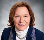 May contain: photography, face, head, person, portrait, happy, smile, adult, female, woman, accessories, jewelry, necklace, clothing, and coat