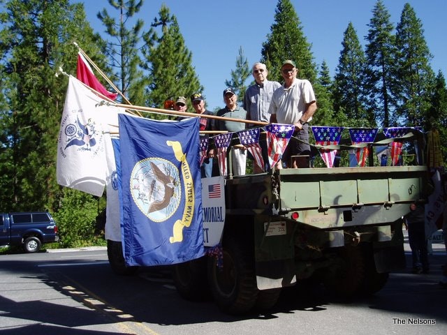 May contain: adult, male, man, person, car, transportation, vehicle, and flag