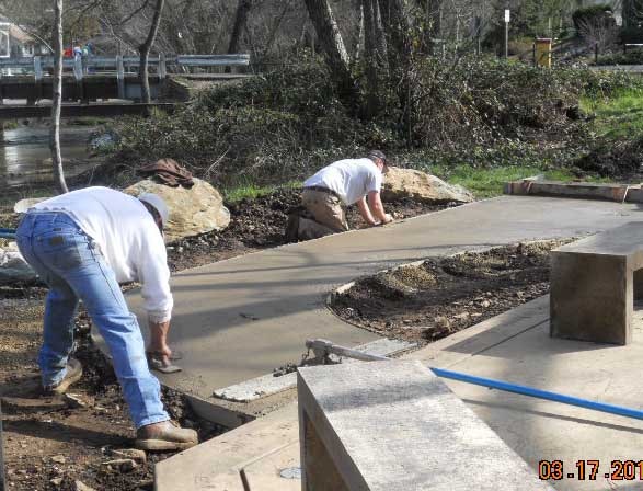 May contain: path, sidewalk, walkway, adult, male, man, person, construction, clothing, and pants