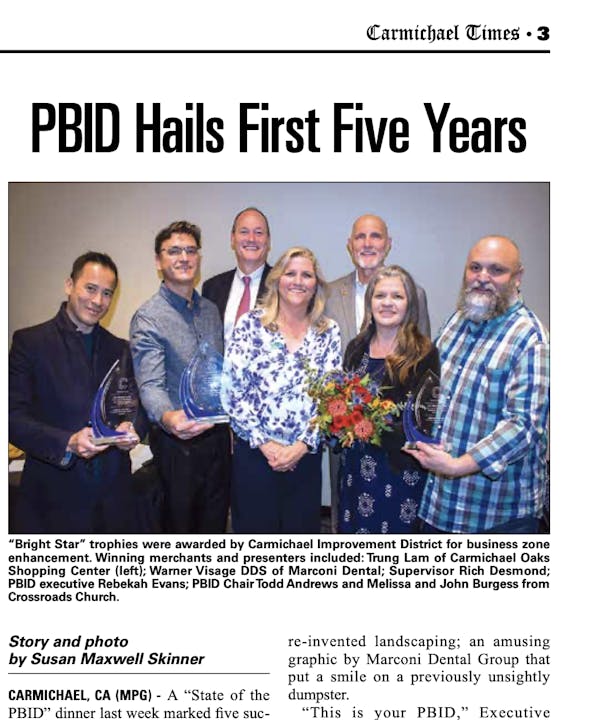Group photo with trophies celebrating PBID's first five years, awarded by Carmichael Improvement District for business enhancement.