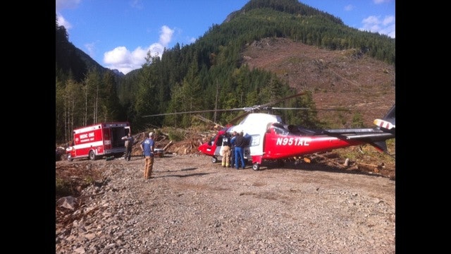 May contain: person, aircraft, helicopter, transportation, vehicle, fire truck, and truck