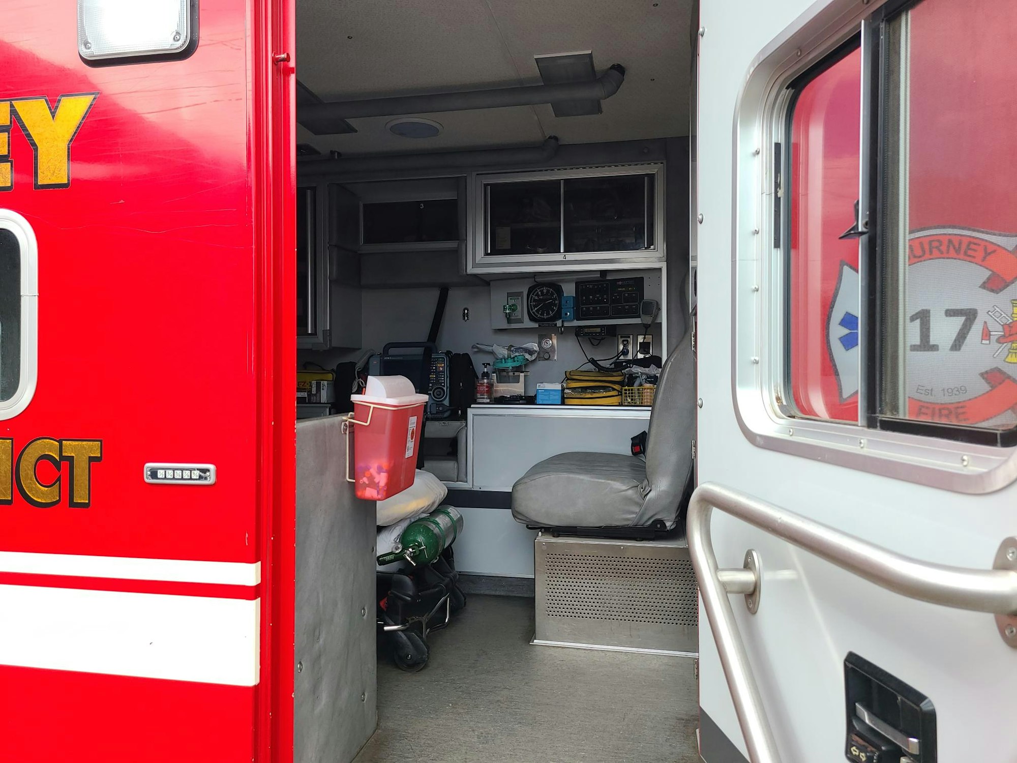Open ambulance door and limited view inside ambulance
