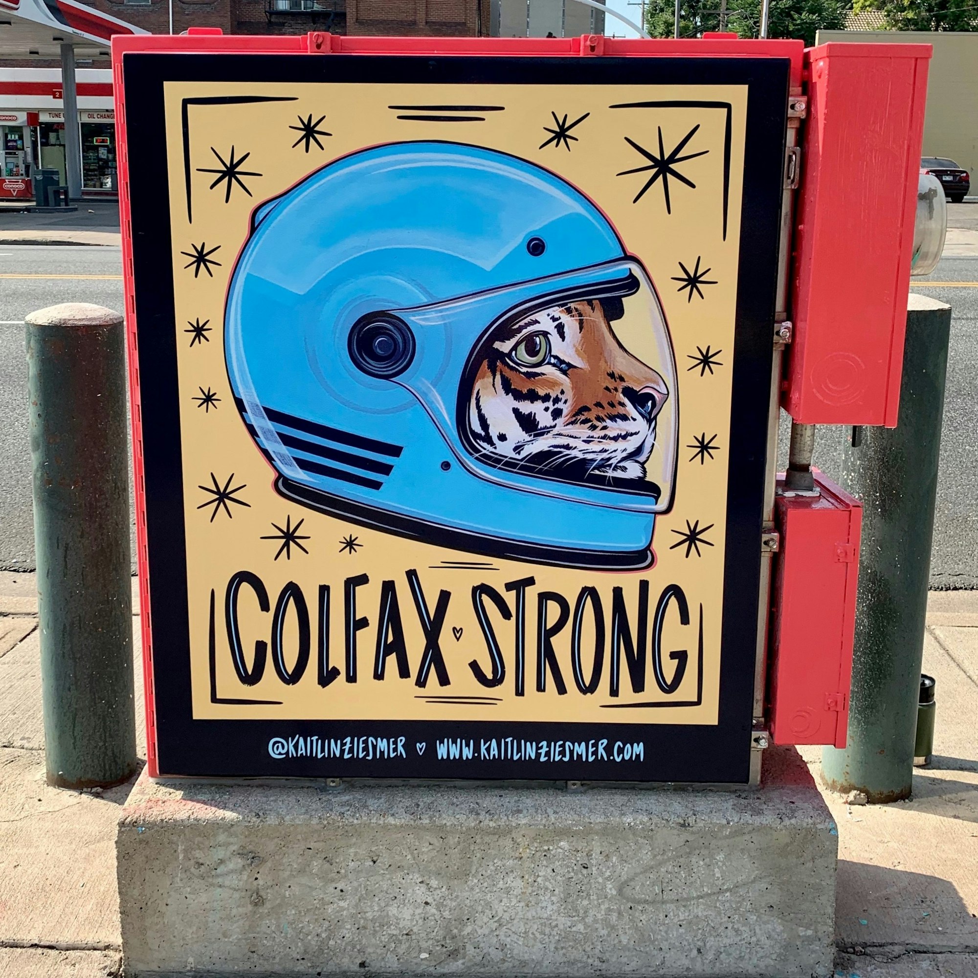 Artwork of a tiger wearing a blue helmet with the text "COLFAX STRONG" on a utility box.