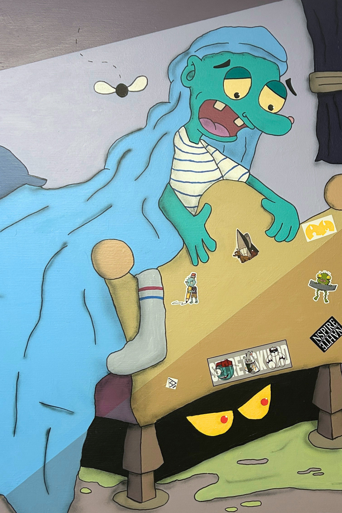 A cartoon-like character in a bed looks surprised, with a fly overhead and eerie eyes peeking from under the bed, surrounded by stickers.