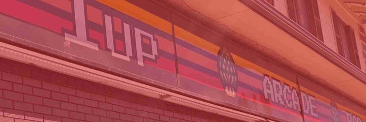 A colorful retro arcade sign with the text "1UP" and "ARCADE" in a pixelated style.