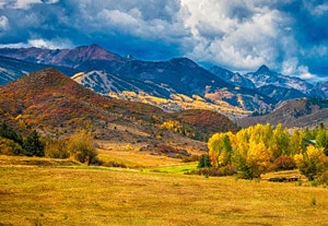 May contain: landscape, nature, outdoors, scenery, grassland, field, mountain range, mountain, panoramic, and countryside