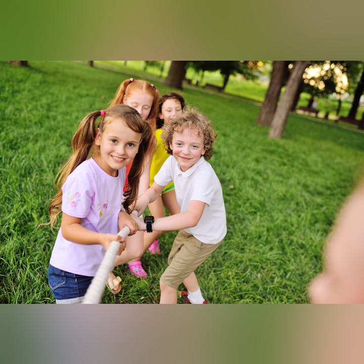 May contain: grass, plant, people, person, child, female, girl, clothing, footwear, sandal, lawn, wristwatch, face, and head