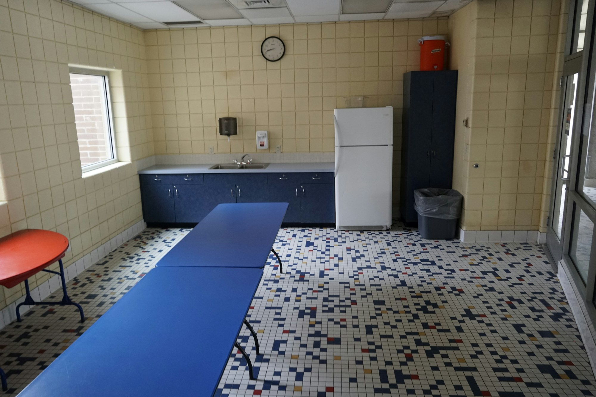 May contain: floor, flooring, appliance, device, electrical device, refrigerator, indoors, interior design, architecture, building, sink, and tile