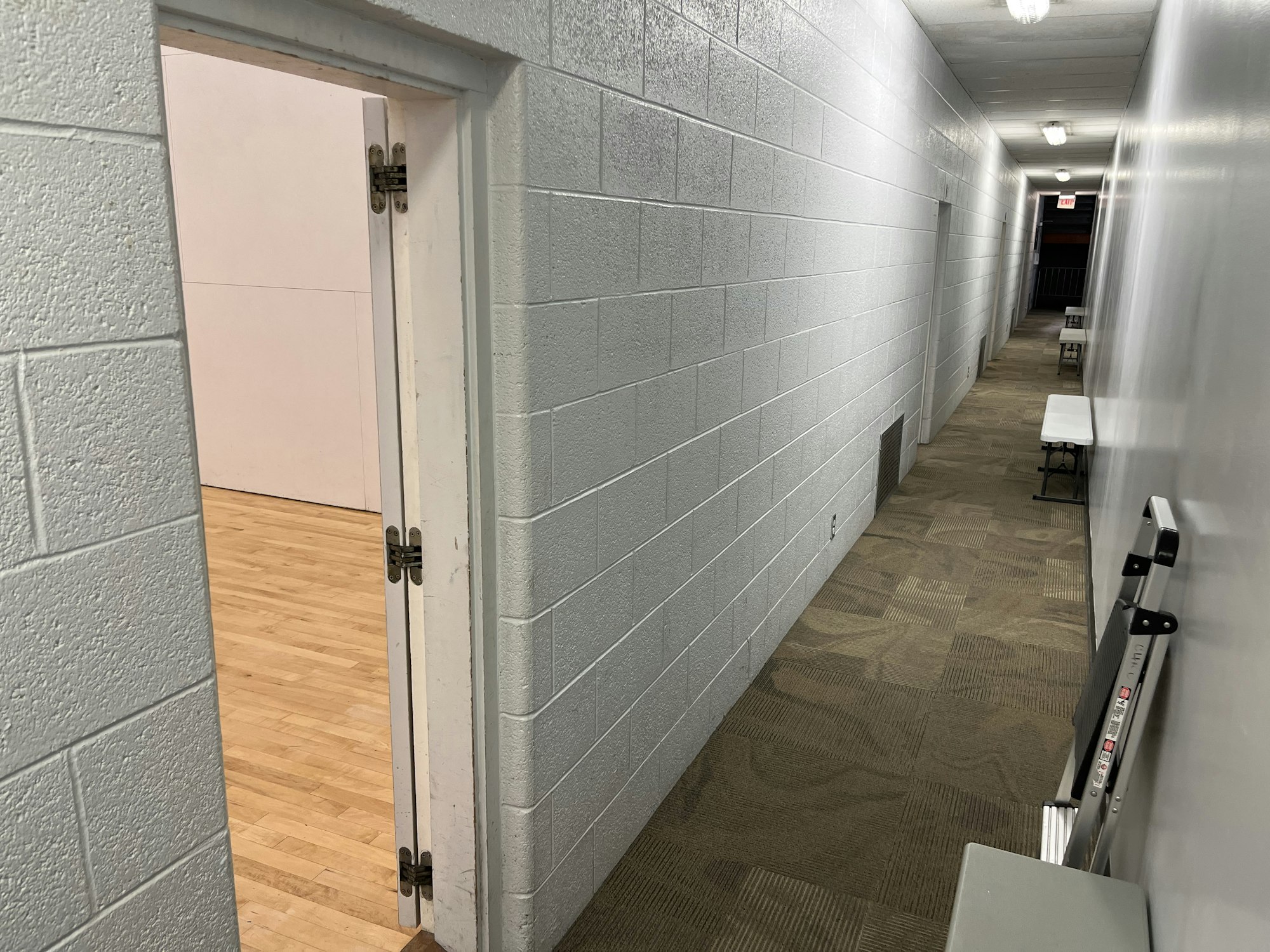 May contain: floor, indoors, interior design, flooring, architecture, building, corridor, chair, and furniture