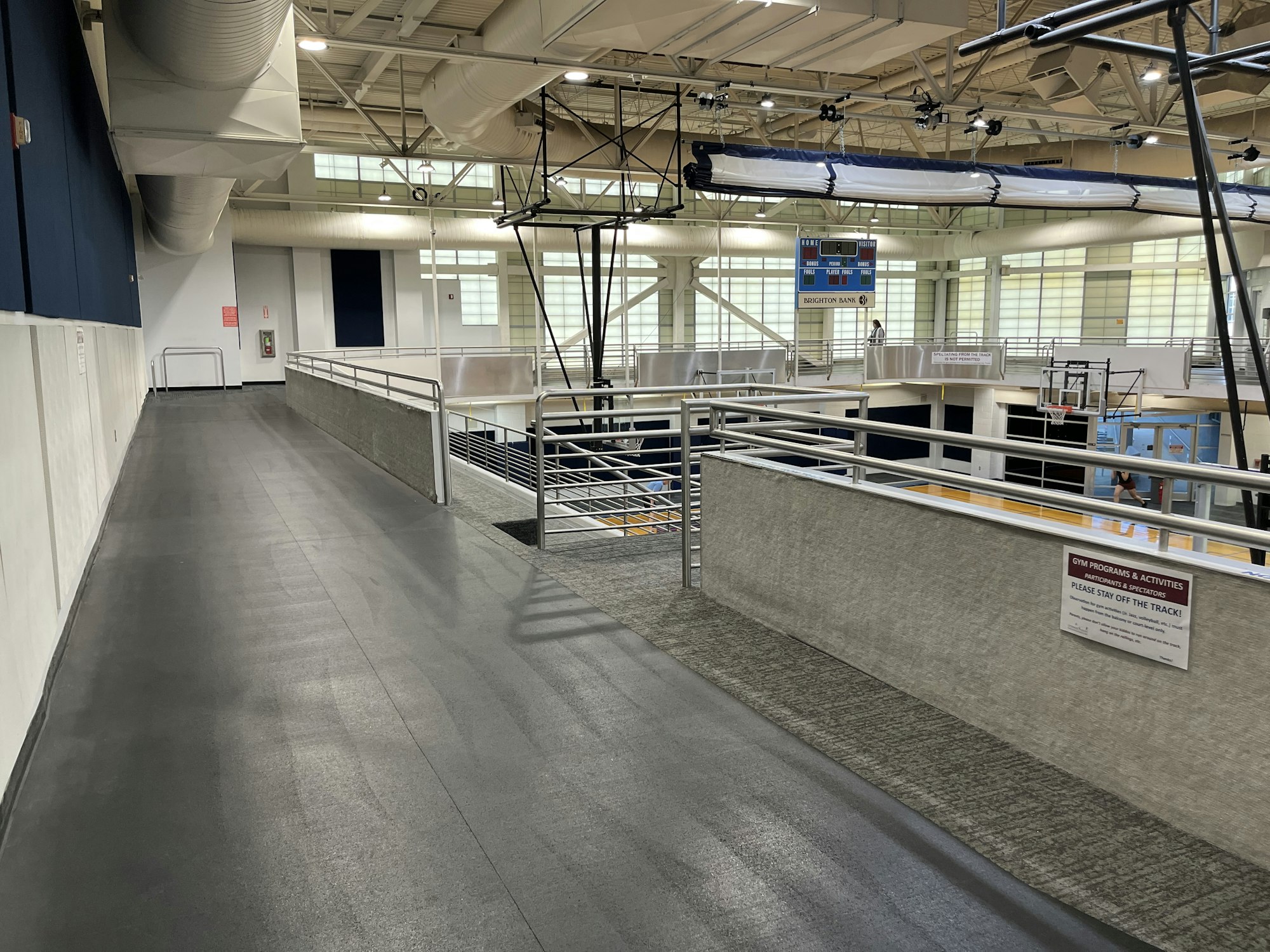 May contain: floor, flooring, handrail, person, railing, and terminal
