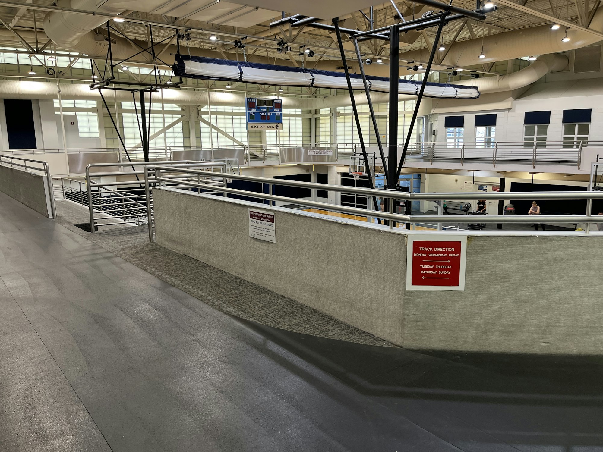 May contain: handrail, floor, terminal, airport, flooring, person, and lamp