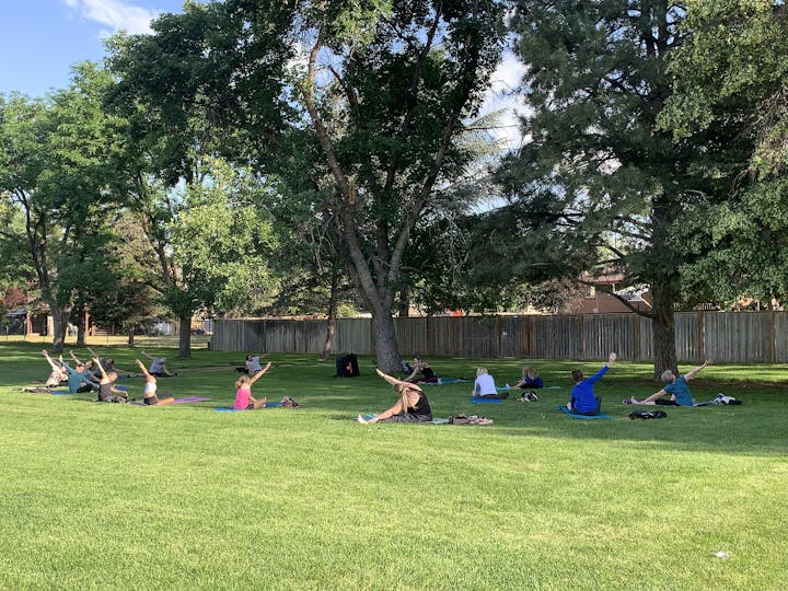 May contain: grass, nature, outdoors, park, plant, backyard, yard, grove, land, tree, vegetation, woodland, lawn, person, summer, people, accessories, bag, handbag, clothing, footwear, shoe, face, head, photography, and portrait