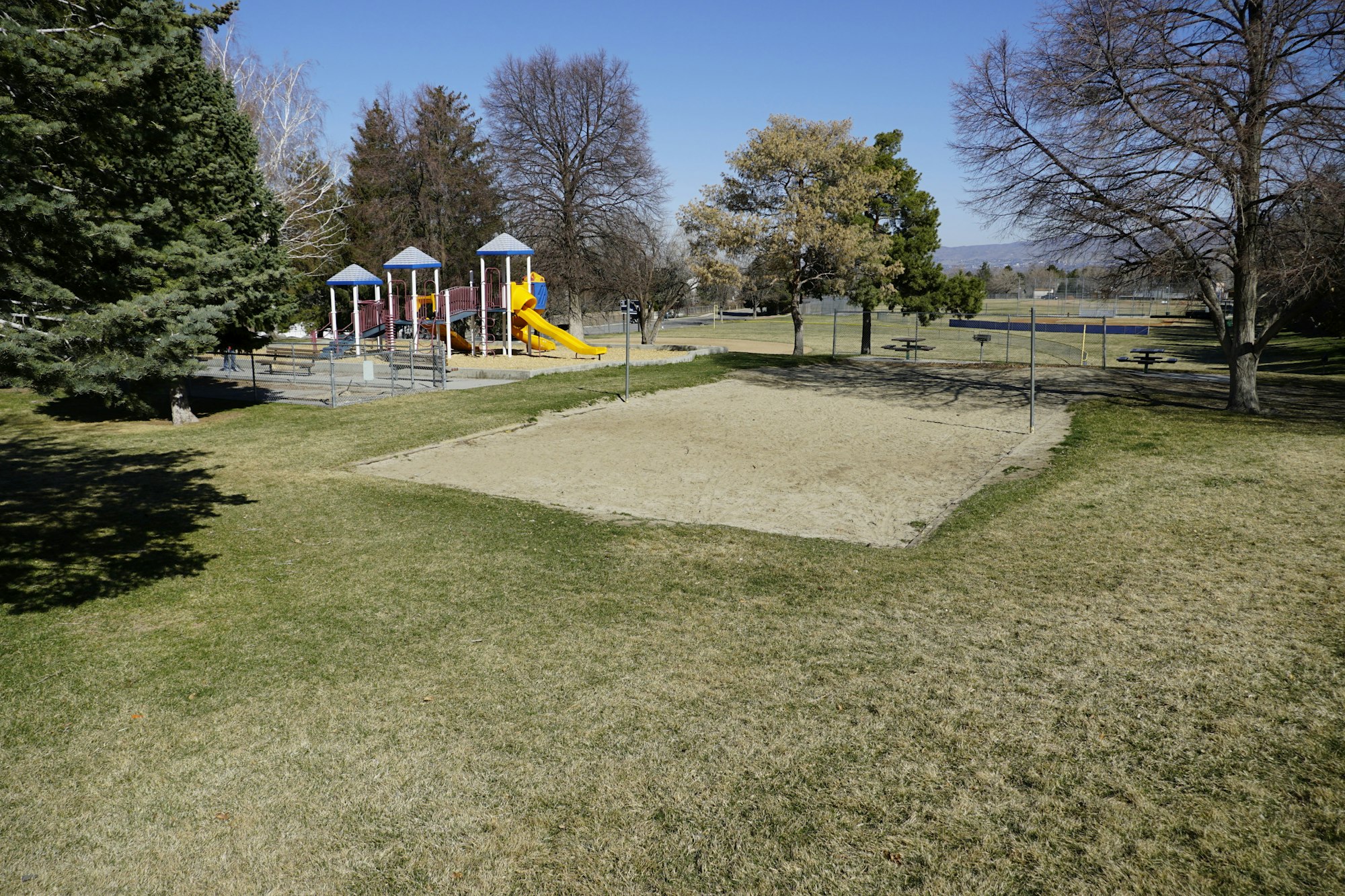 May contain: outdoor play area, outdoors, play area, grass, plant, nature, park, person, bench, and furniture