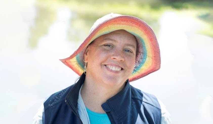 May contain: face, happy, head, person, smile, clothing, hat, photography, portrait, coat, jacket, adult, female, woman, and sun hat