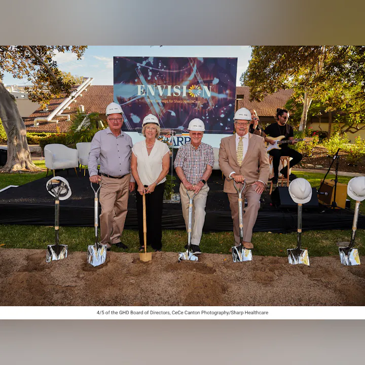 A group of four people in hard hats poses with shovels at a groundbreaking event for Sharp HealthCare's "Envision" campaign.