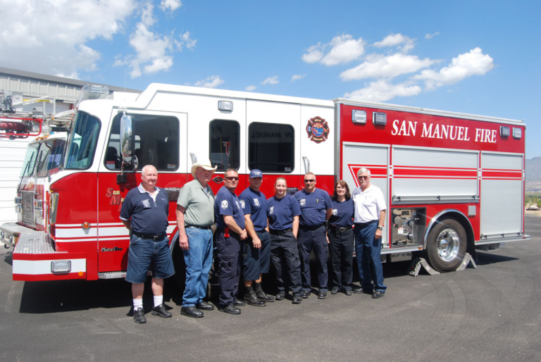 May contain: transportation, truck, vehicle, person, adult, male, man, people, fire truck, and fire station