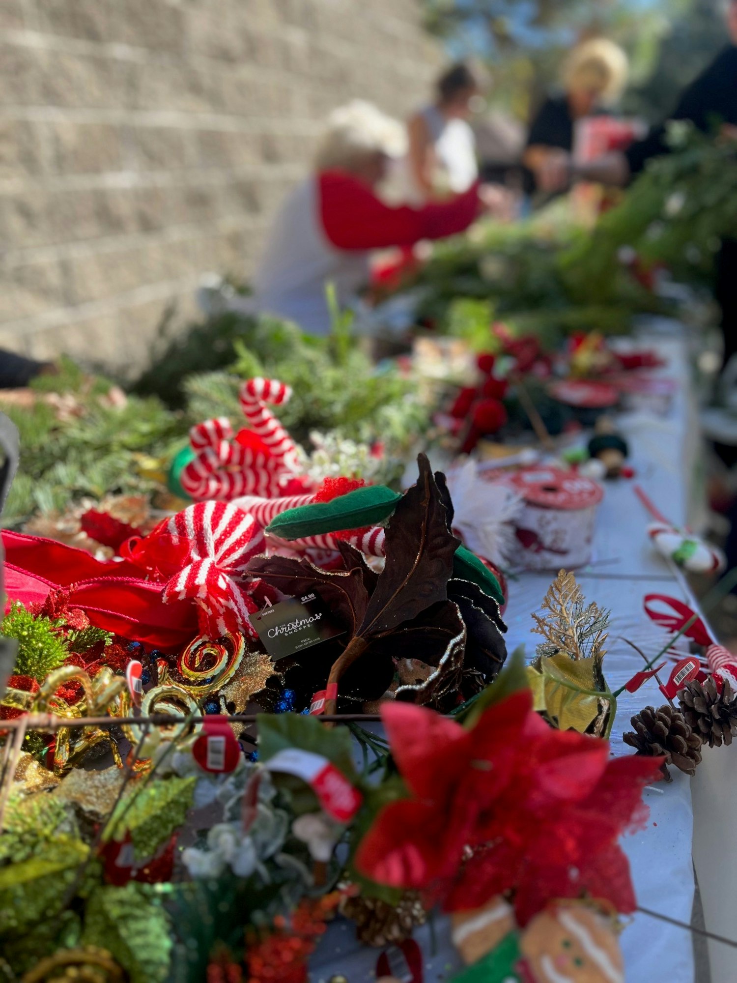 May contain: flower, flower arrangement, plant, flower bouquet, potted plant, leaf, rose, and person