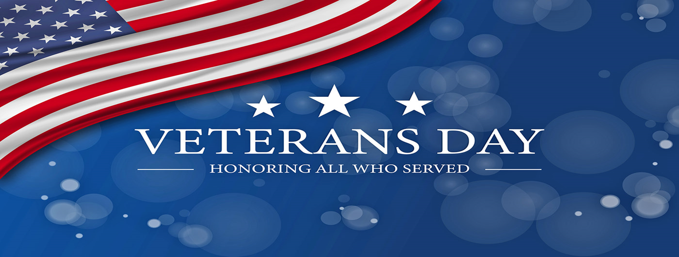 American flag with "Veterans Day: Honoring All Who Served" on a blue background.