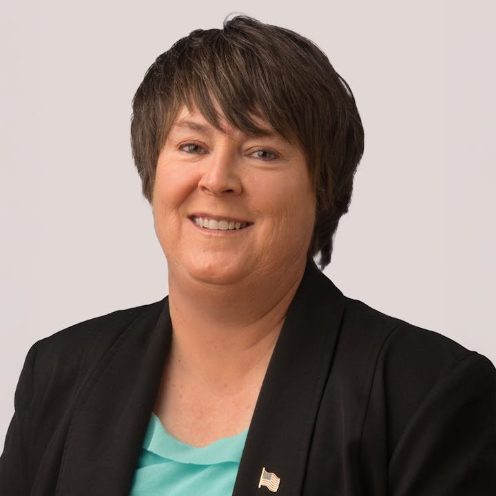 Board Member Tammy Hitchens smiles at the camera