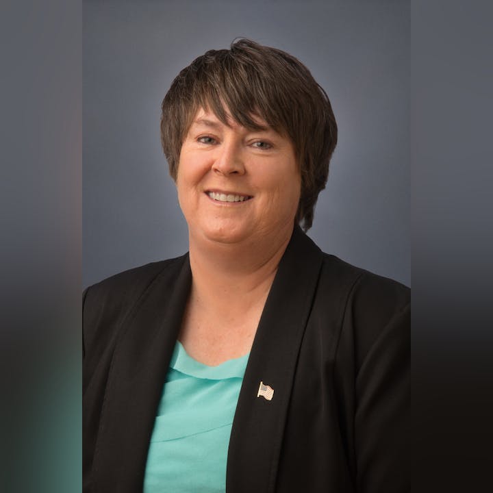 Board Member Tammy Hitchens, CPA, CPFO, smiling at the camera.