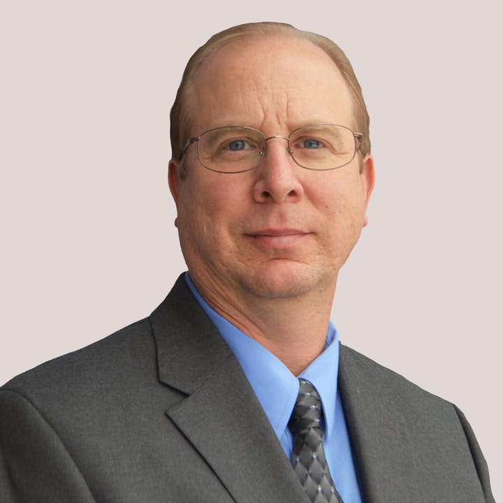 Board Member John Hoehler smiles at the camera.