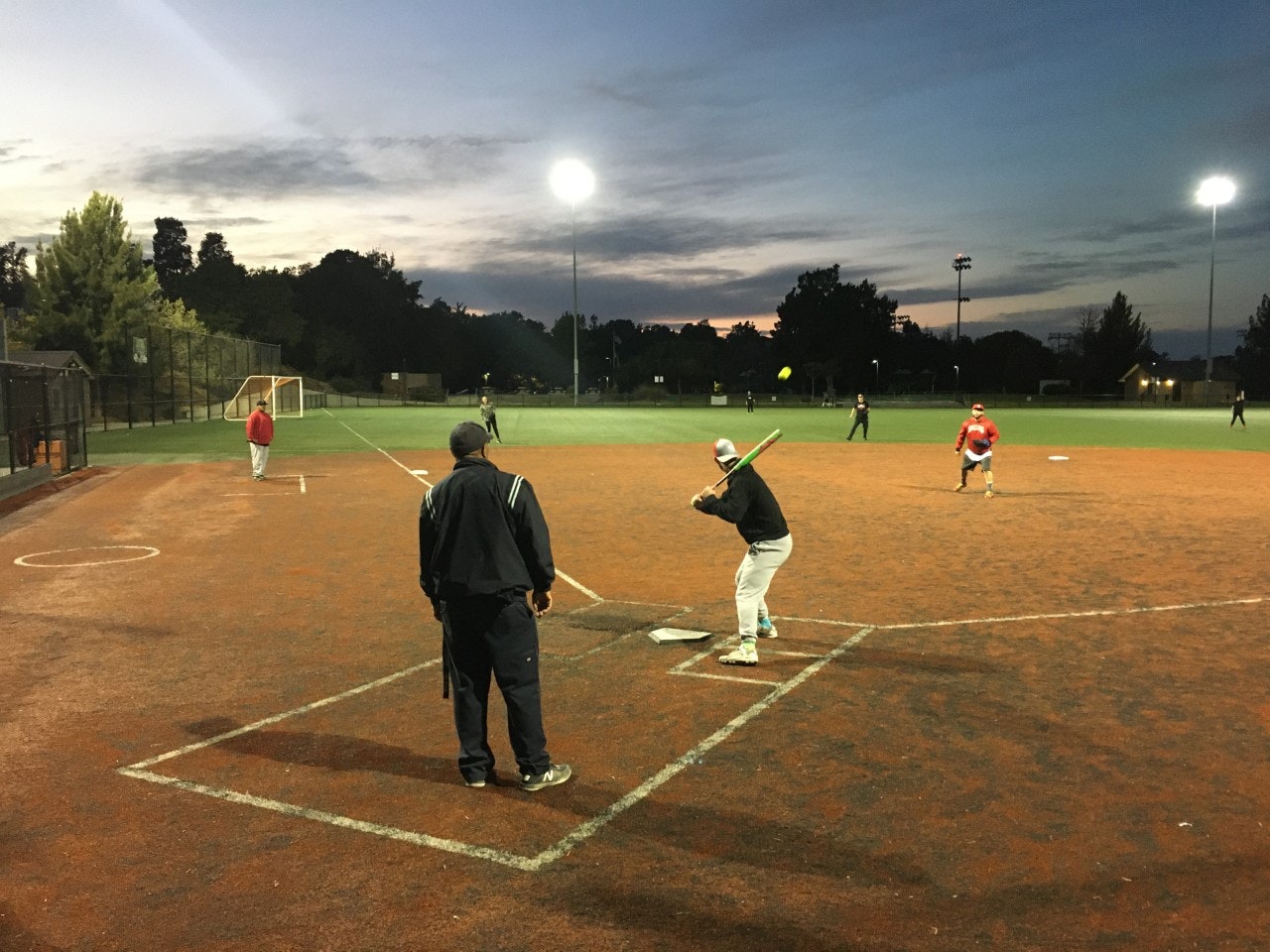 May contain: person, human, building, people, shoe, clothing, footwear, apparel, team sport, sport, team, sports, baseball field, baseball, softball, and arena