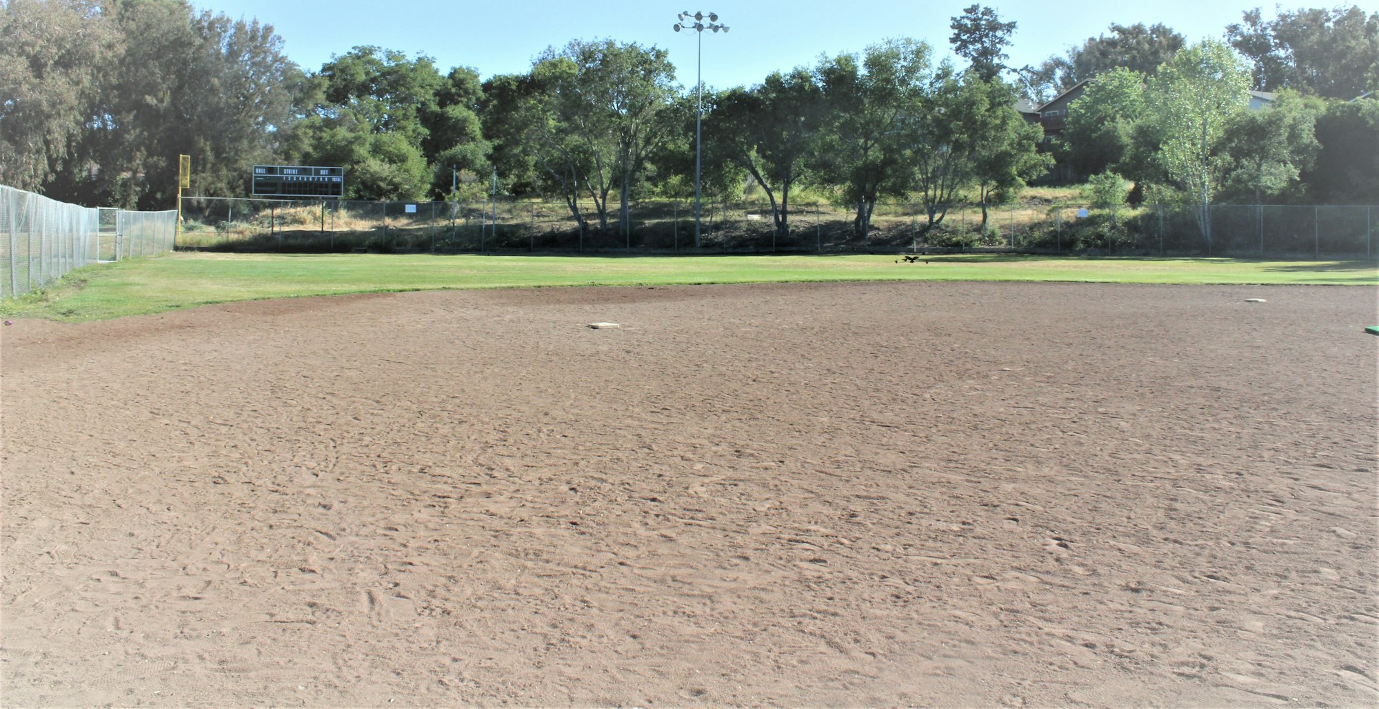 May contain: ground, building, field, soil, baseball field, team, baseball, softball, sport, arena, team sport, sports, land, nature, and outdoors