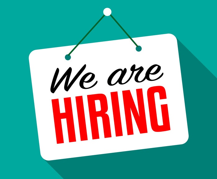 Sign with "We are HIRING" text, indicating a job opportunity.