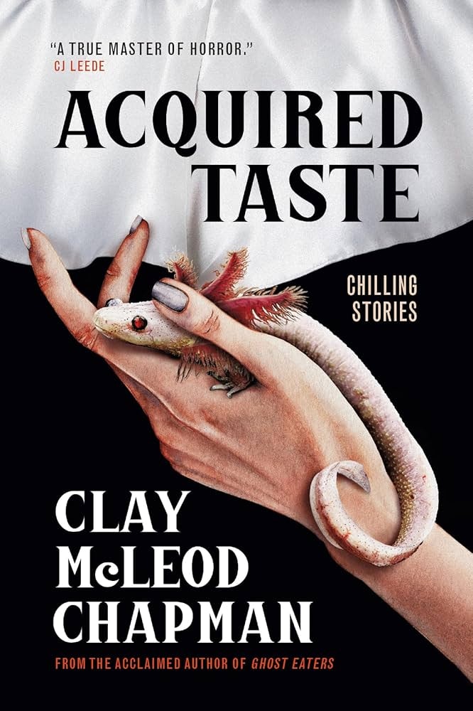Book cover: "Acquired Taste" by Clay McLeod Chapman, featuring a hand holding a lizard. Subtext: "Chilling Stories."