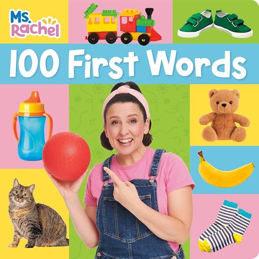 Colorful book cover titled "100 First Words" featuring a person with a red ball, train, shoes, sippy cup, teddy bear, cat, banana, and socks.