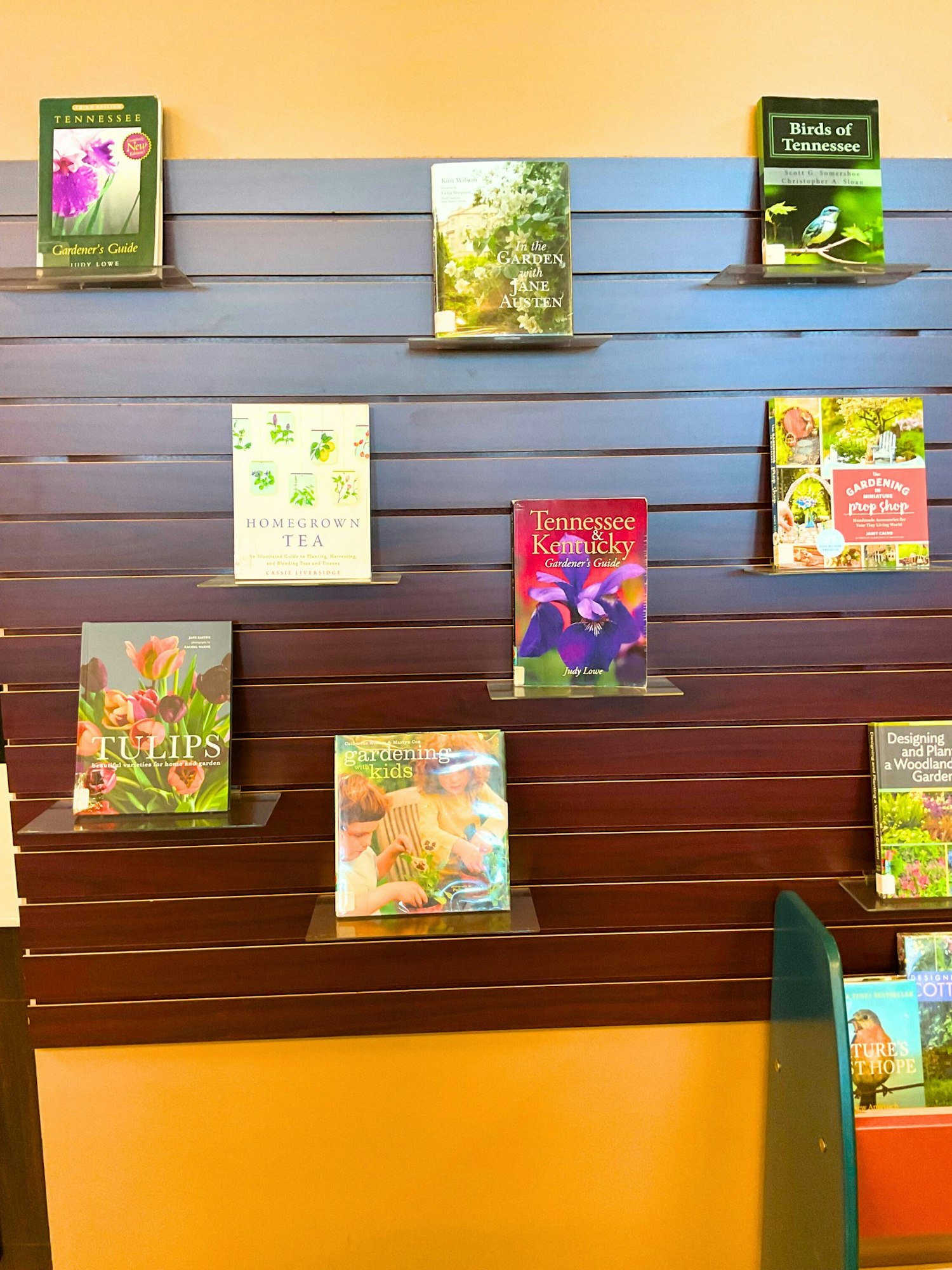 A display of gardening-related books, including guides on Tennessee, tea, tulips, and gardening for kids.