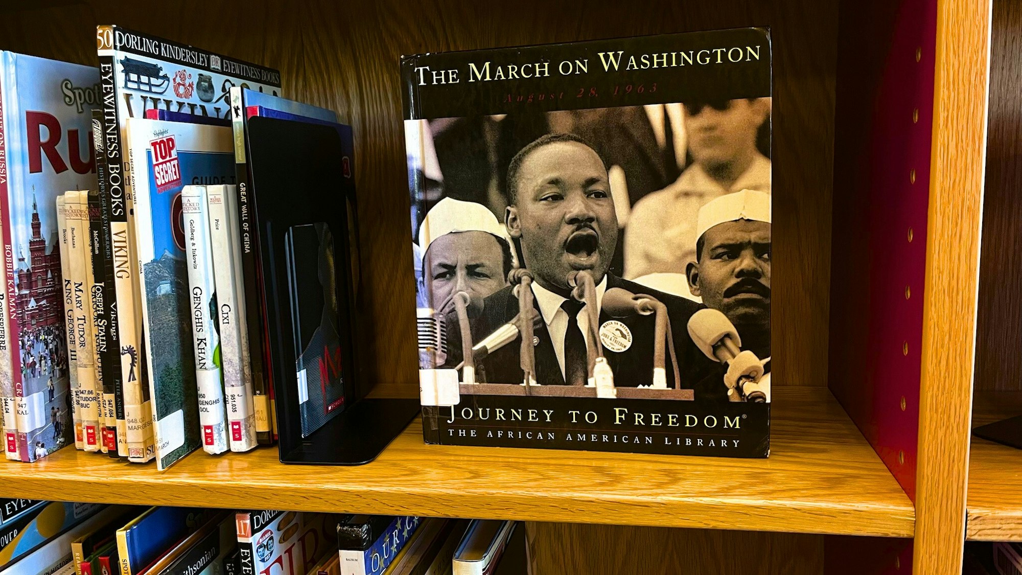 A book titled "The March on Washington" featuring Martin Luther King Jr. speaks about the 1963 civil rights event.