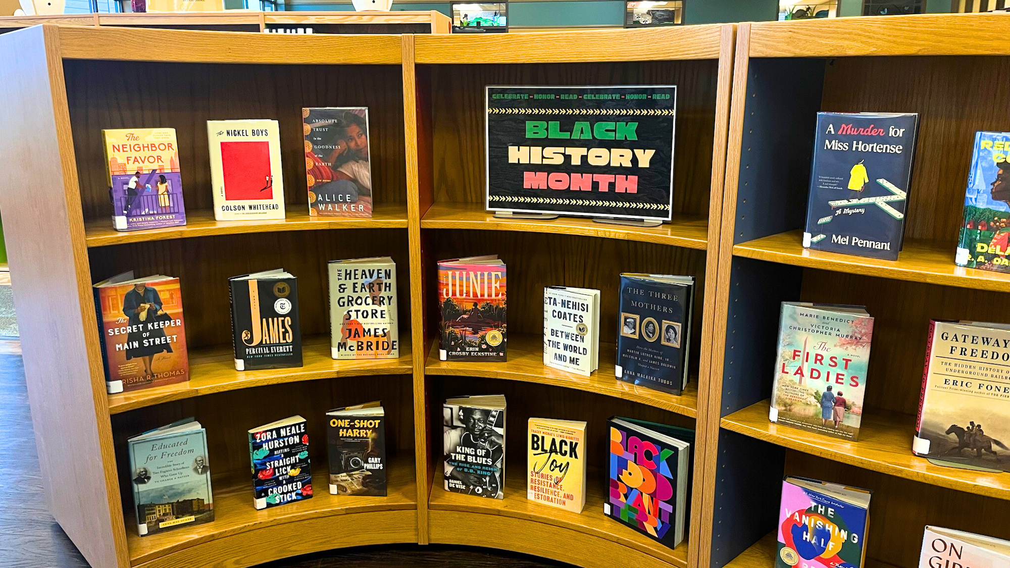 A bookshelf display featuring books by and about Black authors, celebrating Black History Month.
