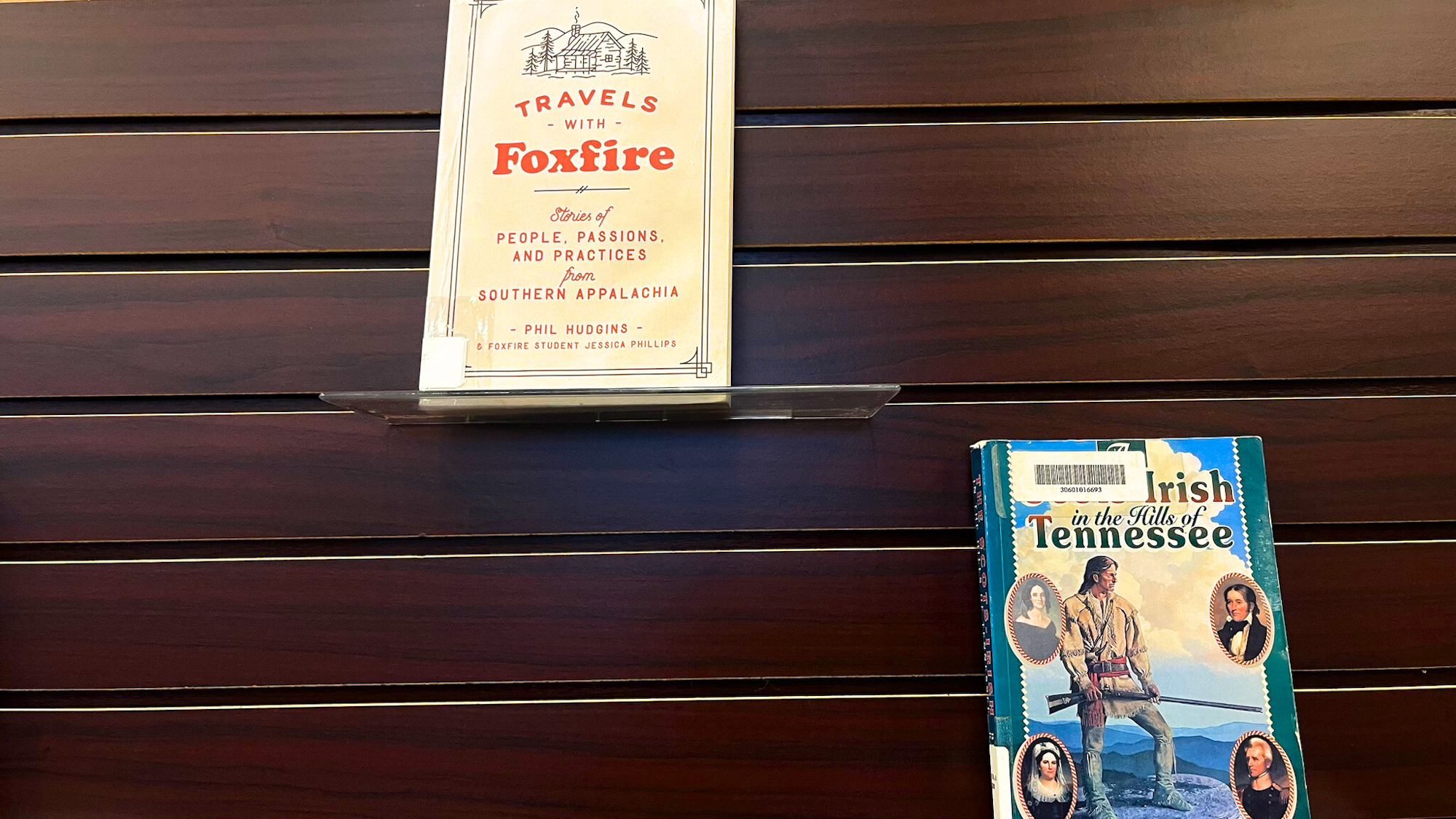 Two books displayed on a shelf: "Travels with Foxfire" about Southern Appalachian culture, and "Irish in the Hills of Tennessee."
