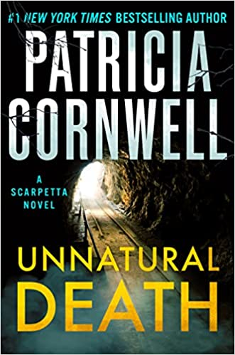 A book cover for "Unnatural Death" by Patricia Cornwell, featuring a tunnel and dramatic lighting.