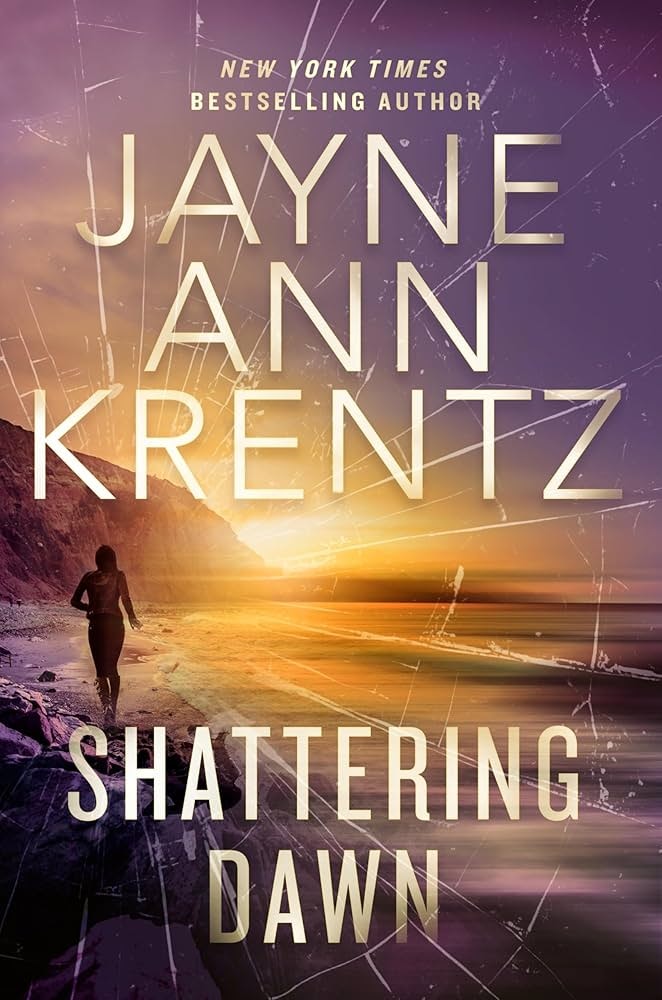 Book cover: "Shattering Dawn" by Jayne Ann Krentz, with a person walking on a beach at sunset.