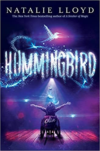 A book cover titled "HUMMINGBIRD" by Natalie Lloyd, featuring a child in a wheelchair and a sparkling trail above.