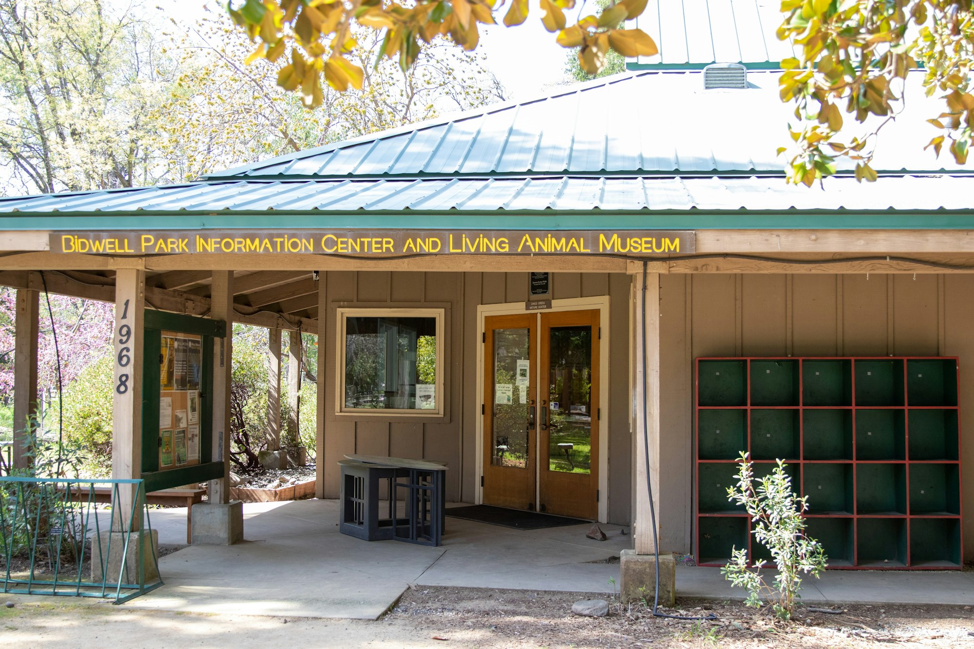 Bidwell Park Information Center & Living Animal Museum entrance with a green roof and outdoor seating.