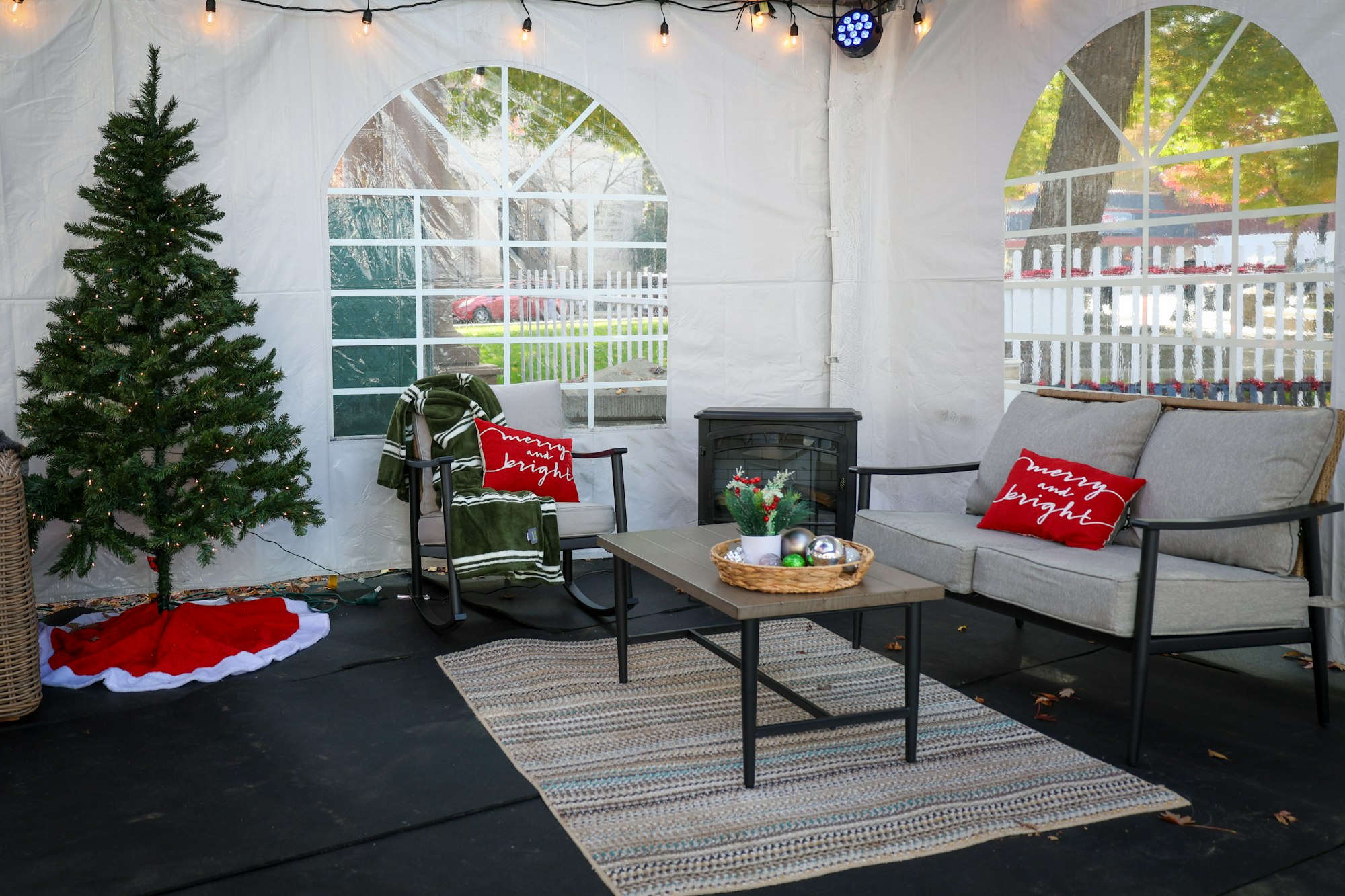 May contain: plant, tree, architecture, building, furniture, indoors, living room, room, fir, home decor, chair, and couch