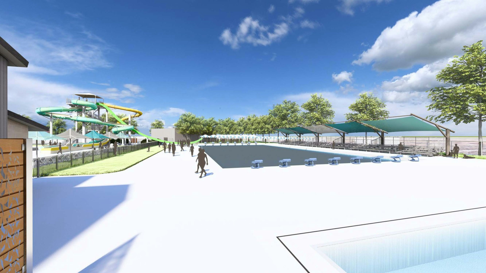 An outdoor water park with slides, a pool, and shaded seating areas on a sunny day.