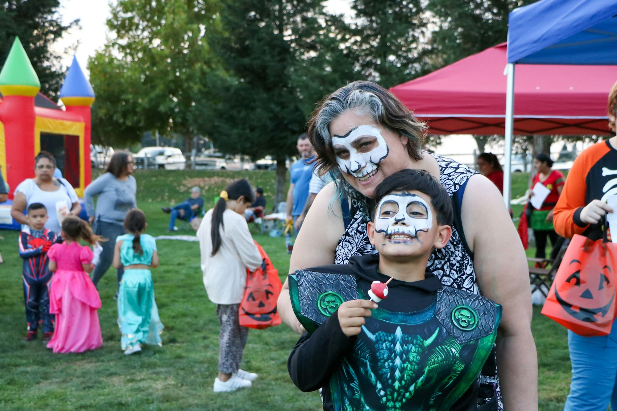 May contain: clothing, costume, person, grass, plant, accessories, bag, handbag, nature, outdoors, park, face, head, photography, portrait, glove, footwear, shoe, chair, furniture, car, transportation, and vehicle
