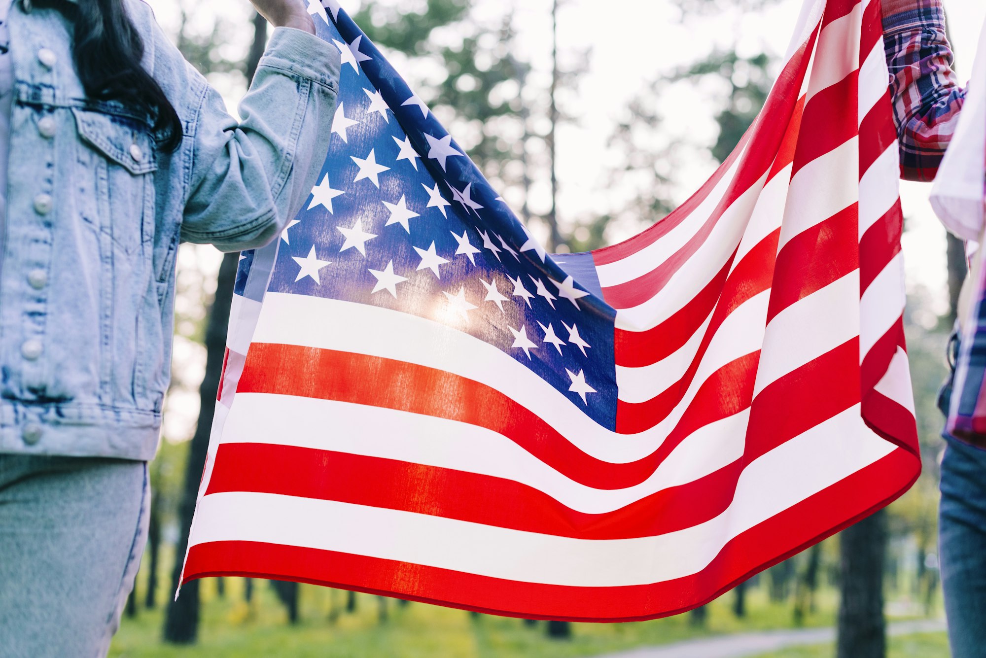 May contain: american flag, flag, and person