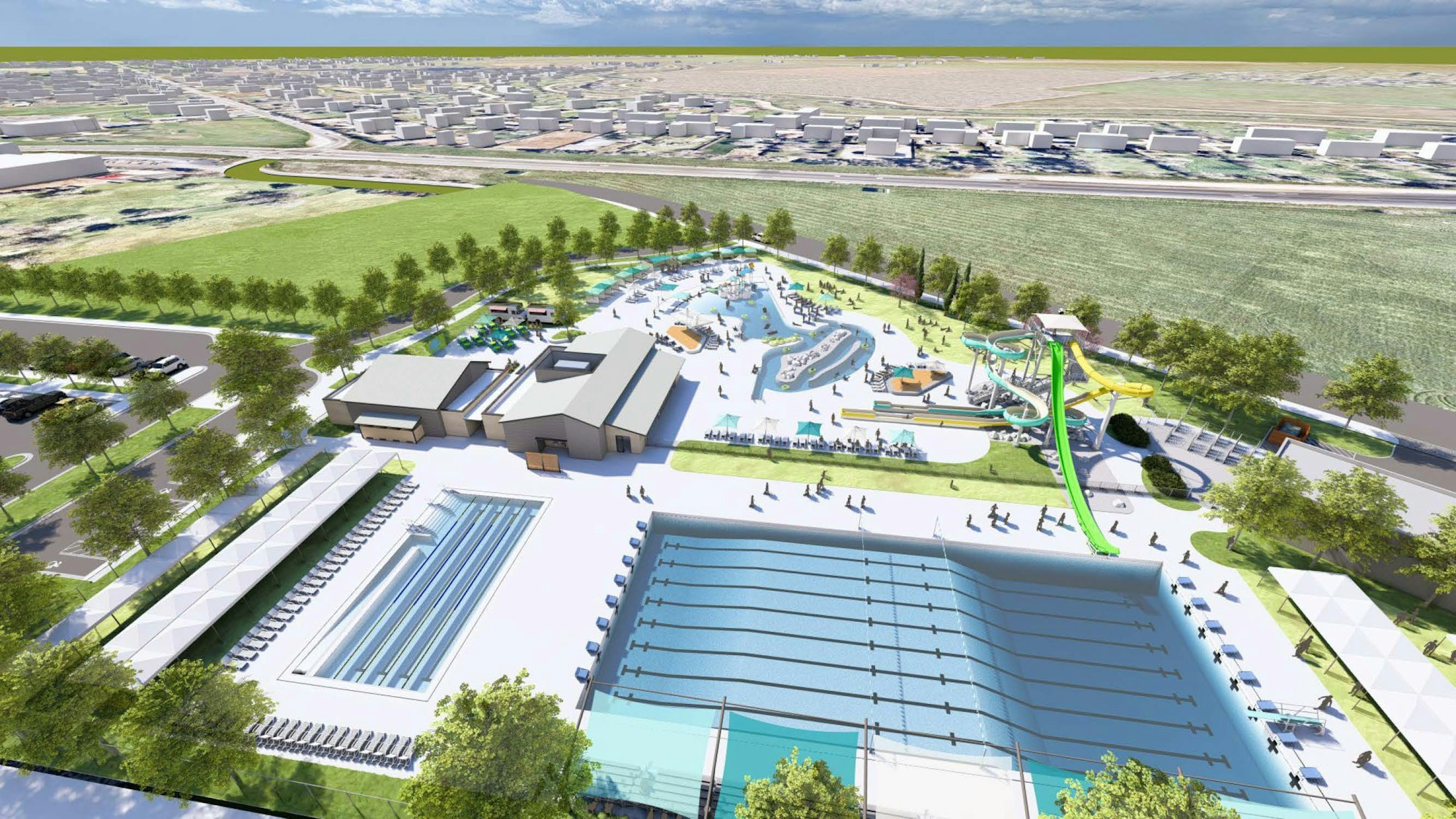 Aerial view of a water park with pools, waterslides, and surrounding greenery.