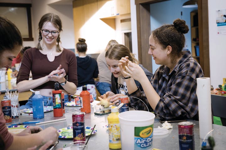 A group of people enjoying an arts and crafts activity.
