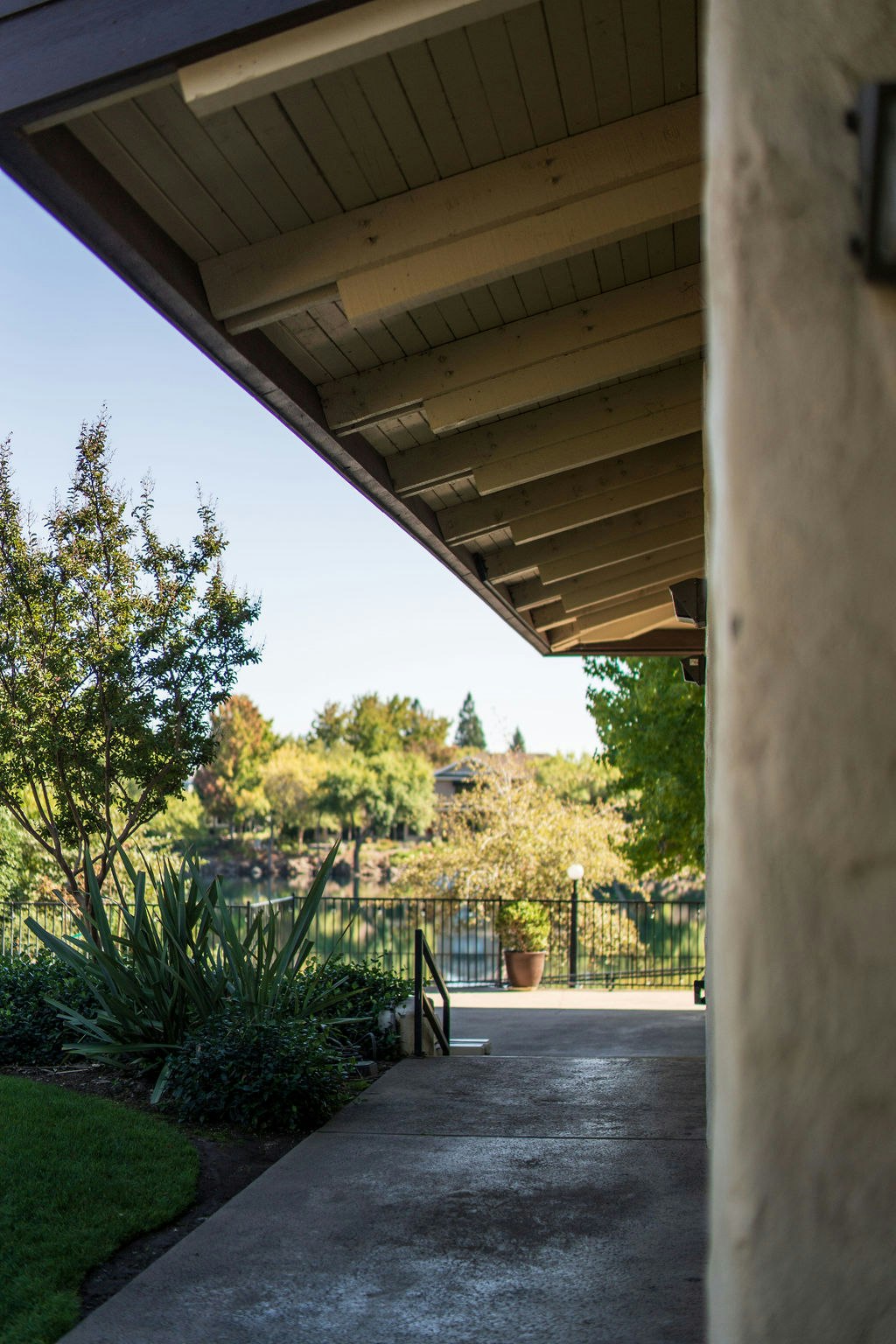 May contain: architecture, building, house, housing, porch, garden, nature, outdoors, patio, path, walkway, arbour, grass, plant, and tree