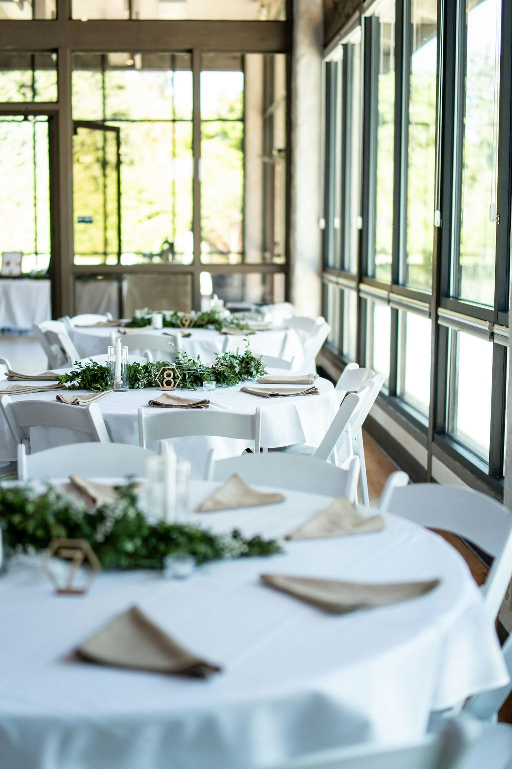 May contain: dining table, furniture, table, architecture, building, dining room, indoors, room, restaurant, tabletop, tablecloth, home decor, and linen