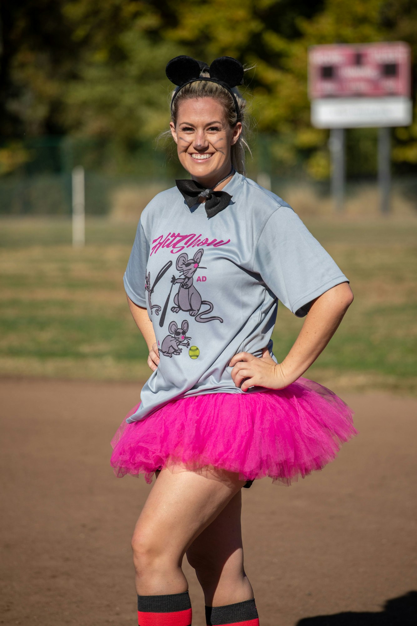 May contain: clothing, skirt, shorts, child, female, girl, person, miniskirt, face, happy, head, and smile