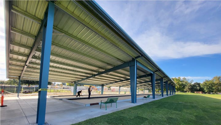 May contain: architecture, building, outdoors, shelter, person, dugout, and sport